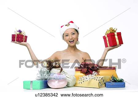 Stock Image - Arm Outstretched, Close-Up, Bow, Asian Ethnicity, Amused. Fotosearch