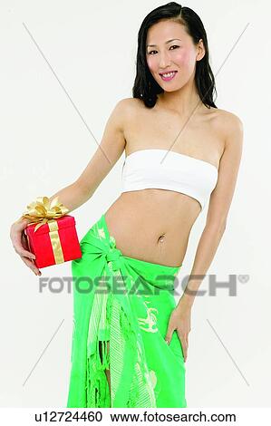 Stock Image - Black Hair, Wrapped, Gift, Casual Clothing, Cut Out, One Young Woman Only. Fotosearch