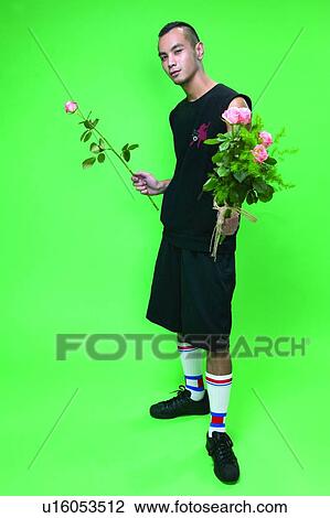 Casual Clothing, Flower, Colored Background, Asian Ethnicity View Large Photo Image Stock Image - Casual Clothing, Flower, Colored Background, Asian Ethnicity. Fotosearch
