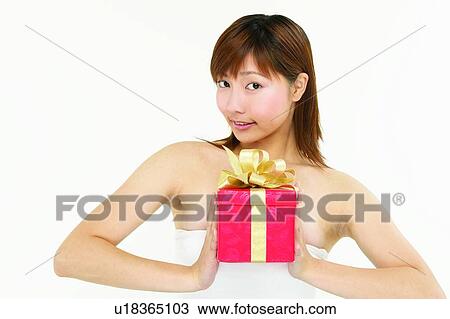 Stock Image - One Young Woman Only, Portrait, Brown Hair, Holding. Fotosearch