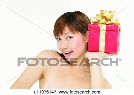Stock Photo - Ribbon, Bow, Lifestyles, Joy, Posing, Red, Asian Ethnicity. Fotosearch