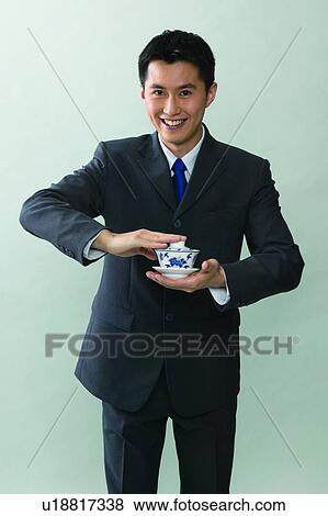 Stock Photo - Smiling, Black Hair, Signals, Toothy Smile, Happiness, Close-Up, Looking At Camera. Fotosearch