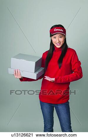 Stock Image - Smiling, Posing, Casual Clothing, Red, One Person, Bangs, Portrait. Fotosearch