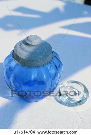Picture - glass, jar, blue, sunlight, shadow. Fotosearch