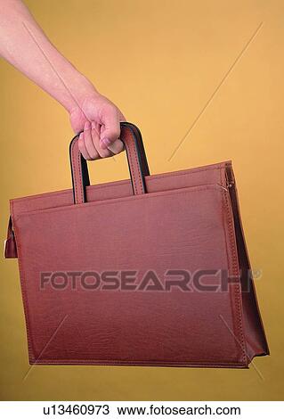 carrying, clutching, briefcase, business, hand View Large Photo Image Stock Image - carrying, clutching, briefcase, business, hand. Fotosearch