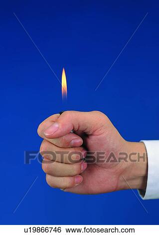 Stock Photograph - fist, lighter, fingers, thumb, hand. Fotosearch