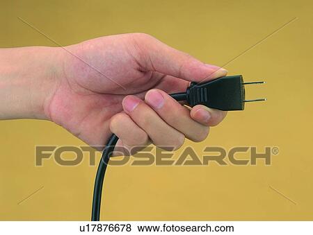 Stock Photo - hand, electrical, cord, appliance, electricity. Fotosearch