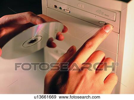 hand, finger, disc, CD, drive, computer View Large Photo Image Stock Photo - hand, finger, disc, CD, drive, computer. Fotosearch
