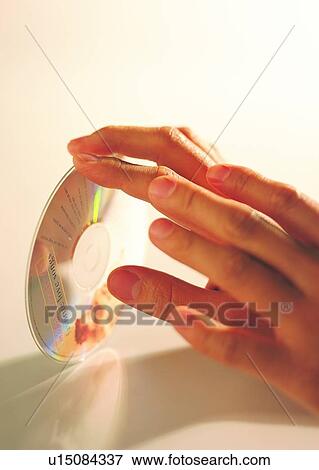 hand, finger, disc, CD View Large Photo Image Stock Photo - hand, finger, disc, CD. Fotosearch