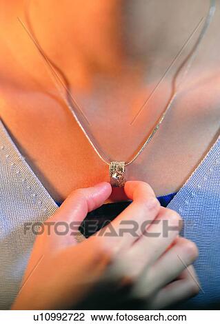hand, finger, holding, necklace, woman, gold View Large Photo Image Stock Image - hand, finger, holding, necklace, woman, gold. Fotosearch