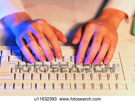 Stock Image - hand, keyboard, typing, finger, fingernail. Fotosearch