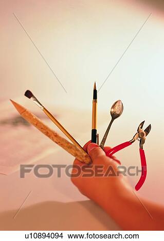 hand, pen, paintbrush, spoon, pliers, tool View Large Photo Image Picture - hand, pen, paintbrush, spoon, pliers, tool. Fotosearch