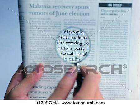 hand, reading, newspaper, finger, magnification, magnifing glass View Large Photo Image Stock Image - hand, reading, newspaper, finger, magnification, magnifing glass. Fotosearch
