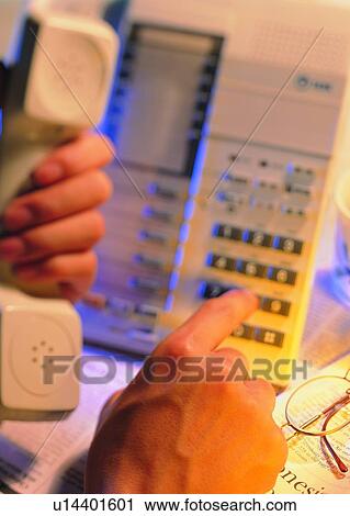 Stock Image - hand, telephone, dialing, keypad, calling. Fotosearch