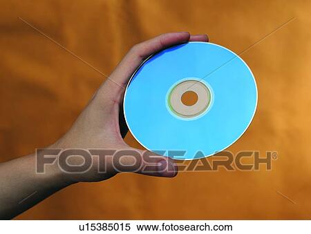 Stock Photography - hand, thumb, compact, disc, CD, grasping. Fotosearch