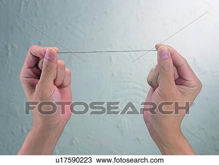 Stock Image - hand, thumb, thumbnail, string, thread, taut. Fotosearch