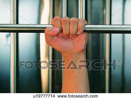 metal, hanging, finger, thumb, hand, gripping View Large Photo Image Picture - metal, hanging, finger, thumb, hand, gripping. Fotosearch