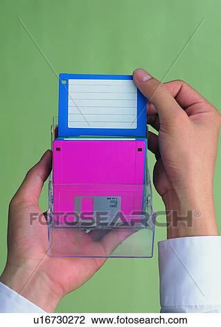 Stock Image - thumb, finger, disk, hand, storage. Fotosearch