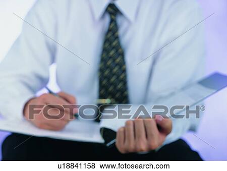 Stock Photo - tie, hands, writing, notebook, pen. Fotosearch