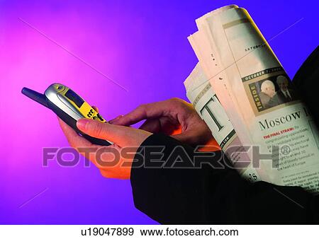 Stock Photo - light, shadow, object, action, hand, newspaper. Fotosearch