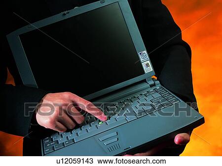 Stock Image - object, indoor, hand, computer, action, notebook. Fotosearch