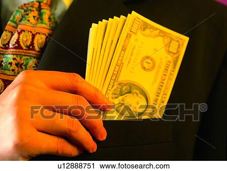 Stock Image - pocket, cash, hand, action, shadow, tie, money. Fotosearch