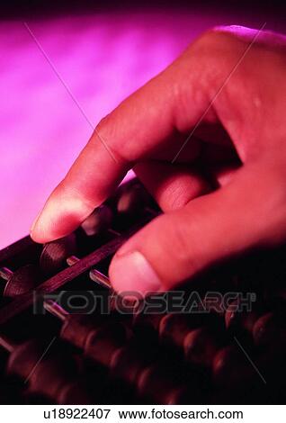 Stock Photo - shadow, hand, object, action, light, abacus. Fotosearch