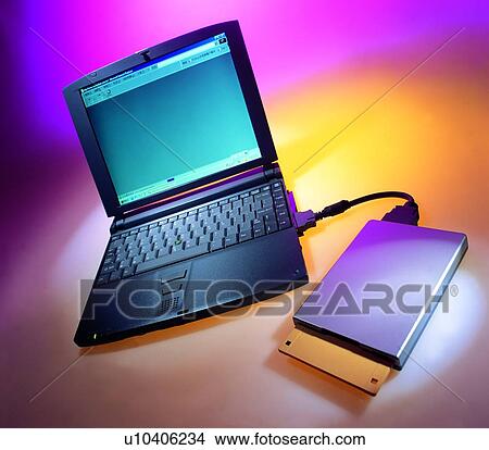 Picture - disk, notebook, floppy disk, office, CD-ROM drive. Fotosearch
