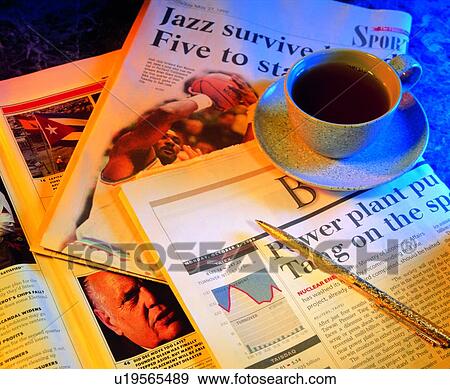 Stock Photo - newspaper, coffee, pen, cup, saucer. Fotosearch