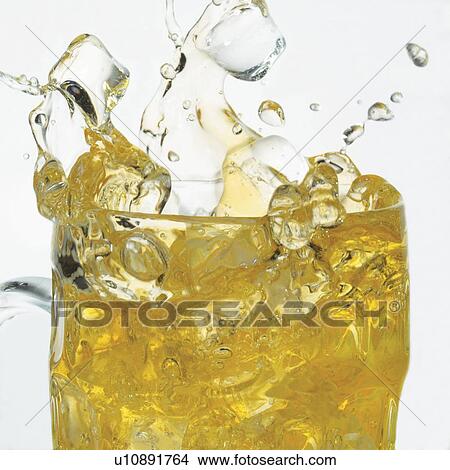 Picture - close-up, cubes, fermented juice, intoxicant, drink, bubbles, fizz. Fotosearch