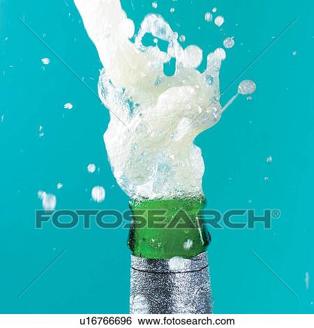 Stock Photograph - driblet, beverage, bottle, liquid, spill, label. Fotosearch