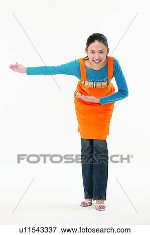 Brown Hair, Arm Outstretched, Body Language, Bending, Asian Ethnicity, Apron View Large Photo Image Stock Photo - Brown Hair, Arm Outstretched, Body Language, Bending, Asian Ethnicity, Apron. Fotosearch
