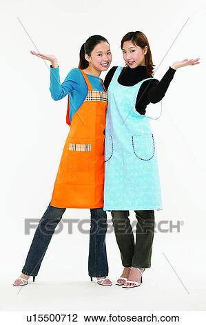 Stock Image - Casual Clothing, Apron, Brown Hair, Body Language, Asian Ethnicity, Adults Only. Fotosearch