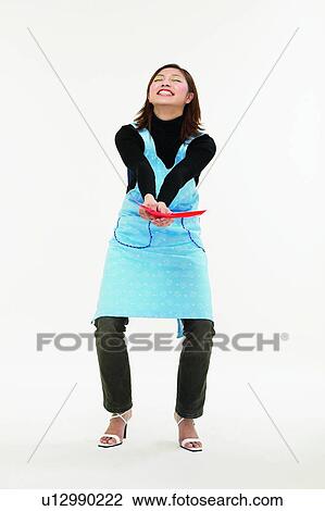 Casual Clothing, Asian Ethnicity, Brown Hair, Body Language, Bending, Apron View Large Photo Image Stock Image - Casual Clothing, Asian Ethnicity, Brown Hair, Body Language, Bending, Apron. Fotosearch