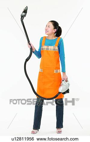 Stock Photograph - Holding, Stiletto, Cleaning, One Young Woman Only, Routine. Fotosearch
