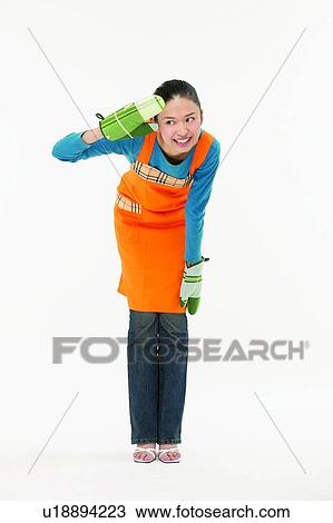 Stock Image - Indoor, Standing, Lifestyles, Apron. Fotosearch