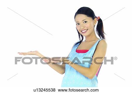 Stock Photo - Indoor, Young Adult, Body Language, Clipping Path, White Background, Smiling. Fotosearch