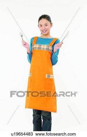 Stock Image - One Person, Indoor, Standing, Cut Out, Three-Quarter Length. Fotosearch