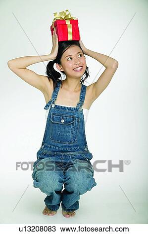 Stock Image - Pigtails, One Young Woman Only. Fotosearch