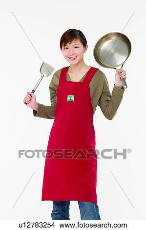 Picture - Spatula, One Young Woman Only, Cut Out, Portrait, Three-Quarter Length. Fotosearch