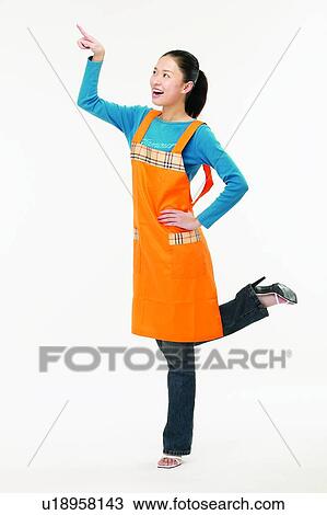 Stock Image - Standing On One Leg, Young Adult, Looking Up. Fotosearch