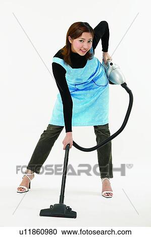 Stock Image - Stiletto, Jeans, Routine, Indoor, Happiness, Brown Hair. Fotosearch