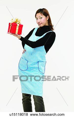 Three-Quarter Length, Young Adult, Holding, Asian Ethnicity, Brown Hair View Large Photo Image Stock Photo - Three-Quarter Length, Young Adult, Holding, Asian Ethnicity, Brown Hair. Fotosearch