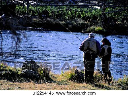 Stock Photography - couple, lake, fishing, lakeside, warm, love, outside. Fotosearch