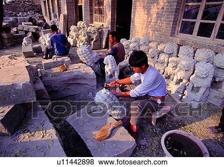 Stock Photo - male, carve, sculpture, carving, artistic carving, sculptor. Fotosearch