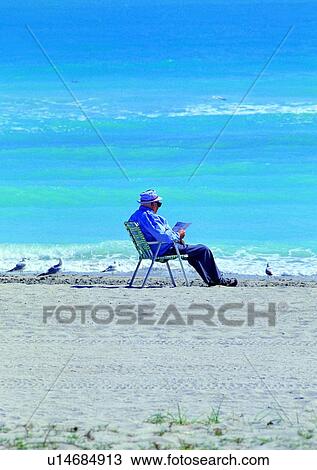 seniorcitizen, newspaper, sit, read, beach, sea, coast View Large Photo Image Stock Image - seniorcitizen, newspaper, sit, read, beach, sea, coast. Fotosearch