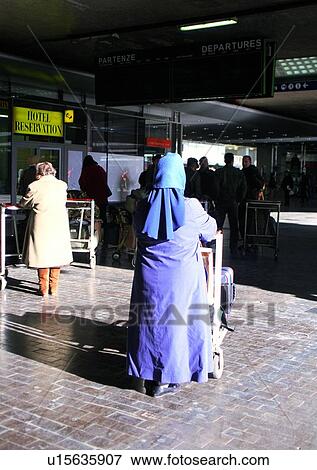 Stock Photo - walk, woman, platform, luggage, female, departure, airport. Fotosearch