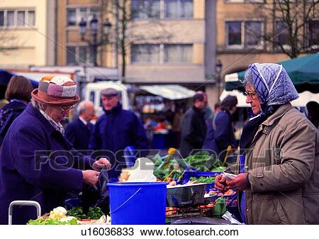 Stock Image - winter, cold, market, deal, sale, buy, people. Fotosearch