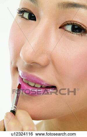Asian Ethnicity, Close-Up, Applying View Large Photo Image Stock Photograph - Asian Ethnicity, Close-Up, Applying. Fotosearch