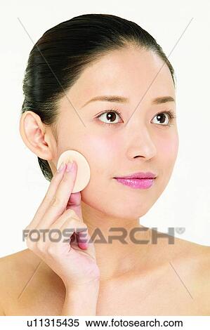 Stock Photography - Asian Ethnicity, Close-Up, Applying. Fotosearch